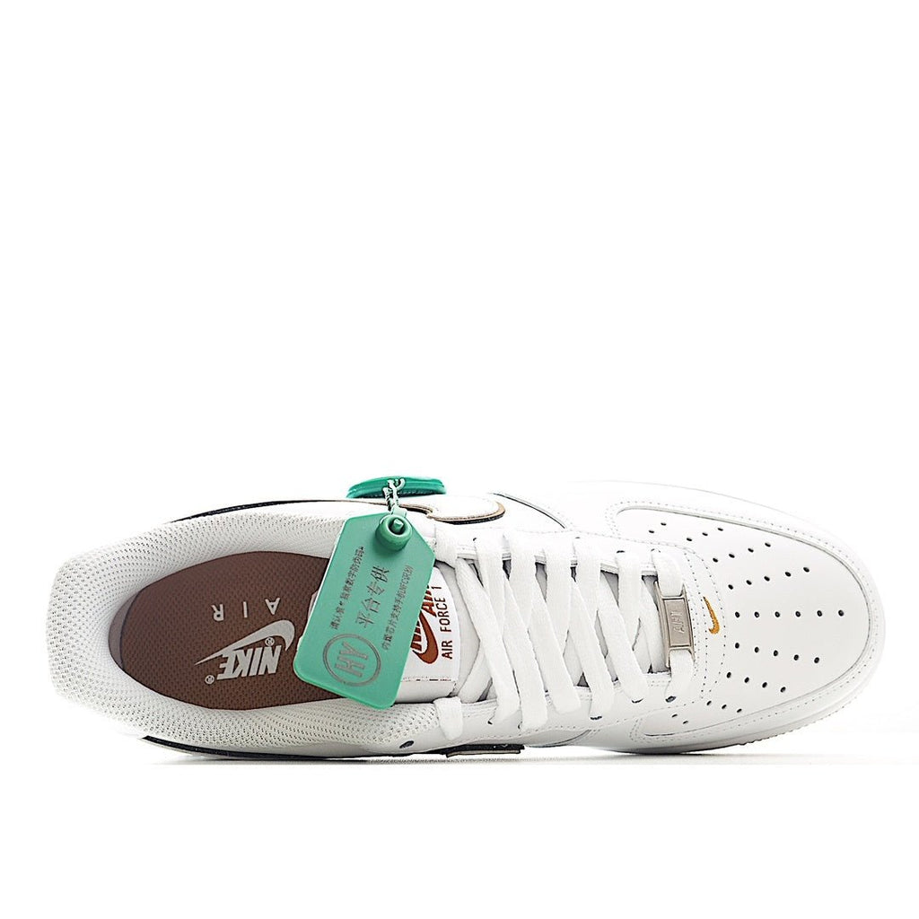 Nike Air Force 1 low-top sneakers, white leather with brown outsole and visible inner lining