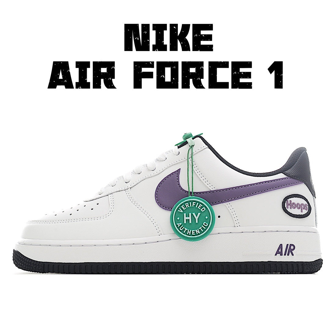White low-top sneaker with purple swoosh, green HY tag, black outsole and heel tab
