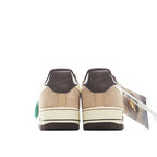 Tan suede Nike sneaker heel view with dark collar, green tag, cream midsole
