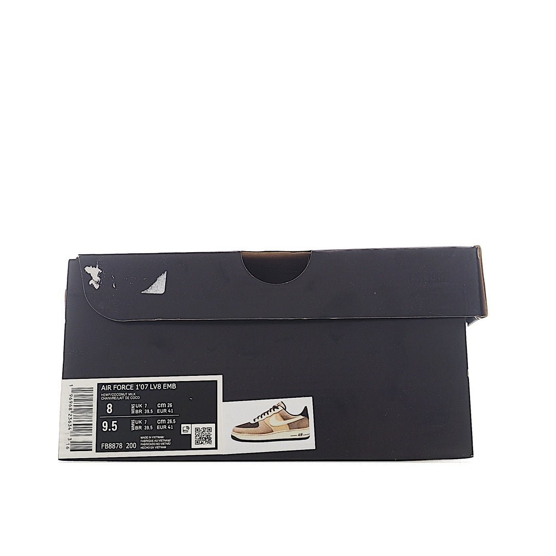 Sneaker shoe box with black design, barcode label, and small shoe image