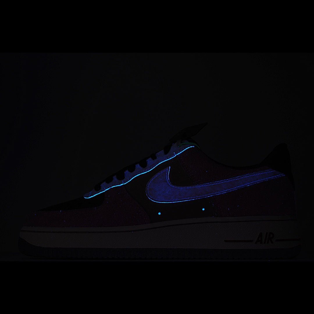 Dark navy Nike athletic sneaker with blue swoosh and AIR branding on sole