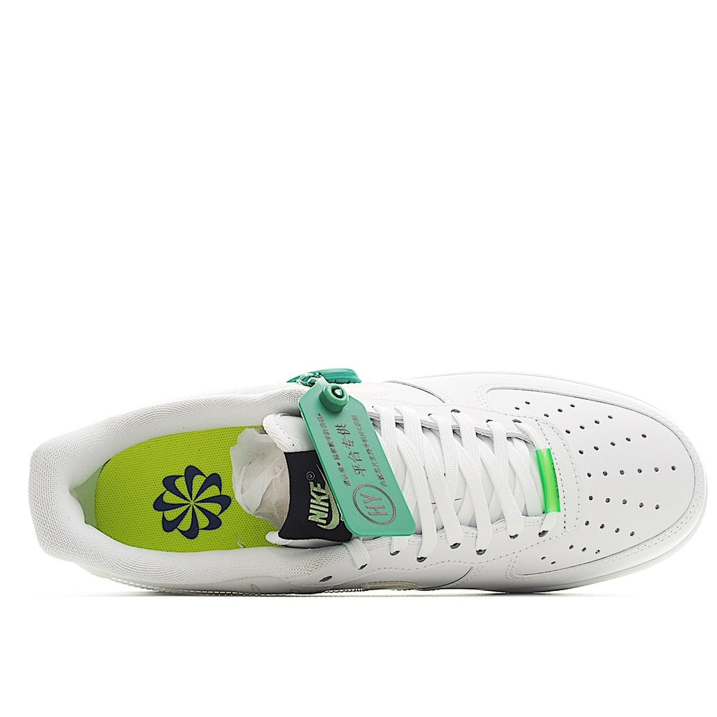 White low-top sneaker with open collar, green floral lining, and neon yellow sole
