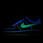 Dark low-top sneakers with blue glowing lines and green swoosh