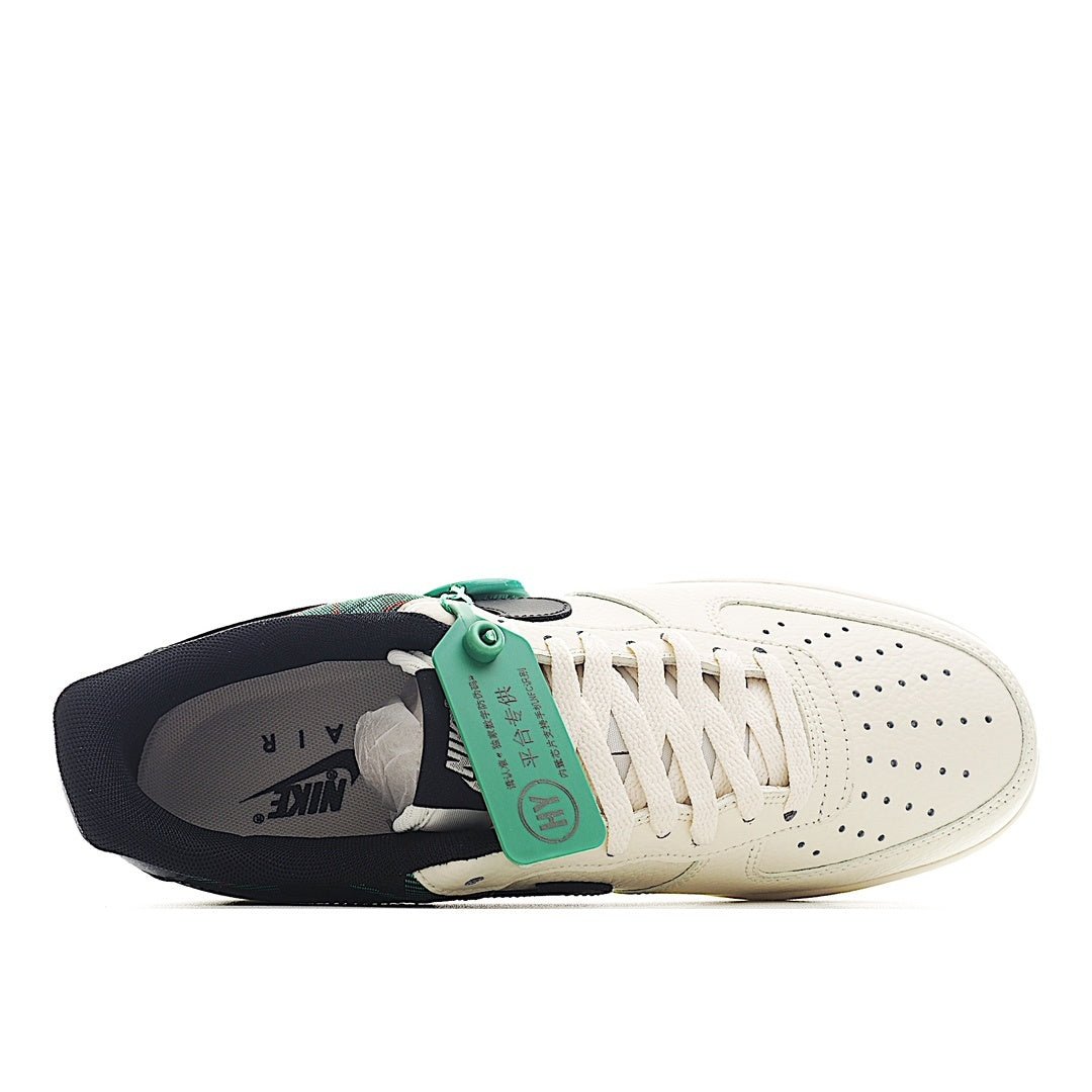 Nike Air Force 1 sneakers, white leather with green tag on tongue and dark interior