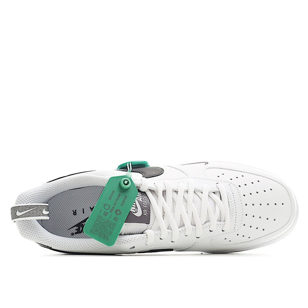 White sneaker sole and side profile with green hang tag