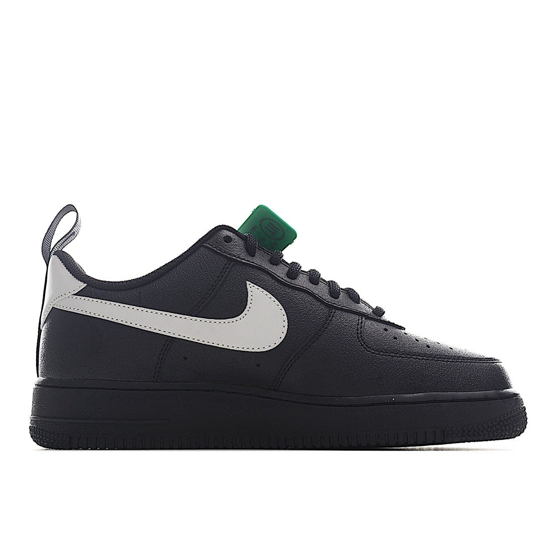 Nike Air Force 1 low-top sneakers, black upper with white strap and white swoosh