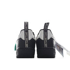 Nike Air Force 1 low-top sneakers, rear view with black heel and white side panel