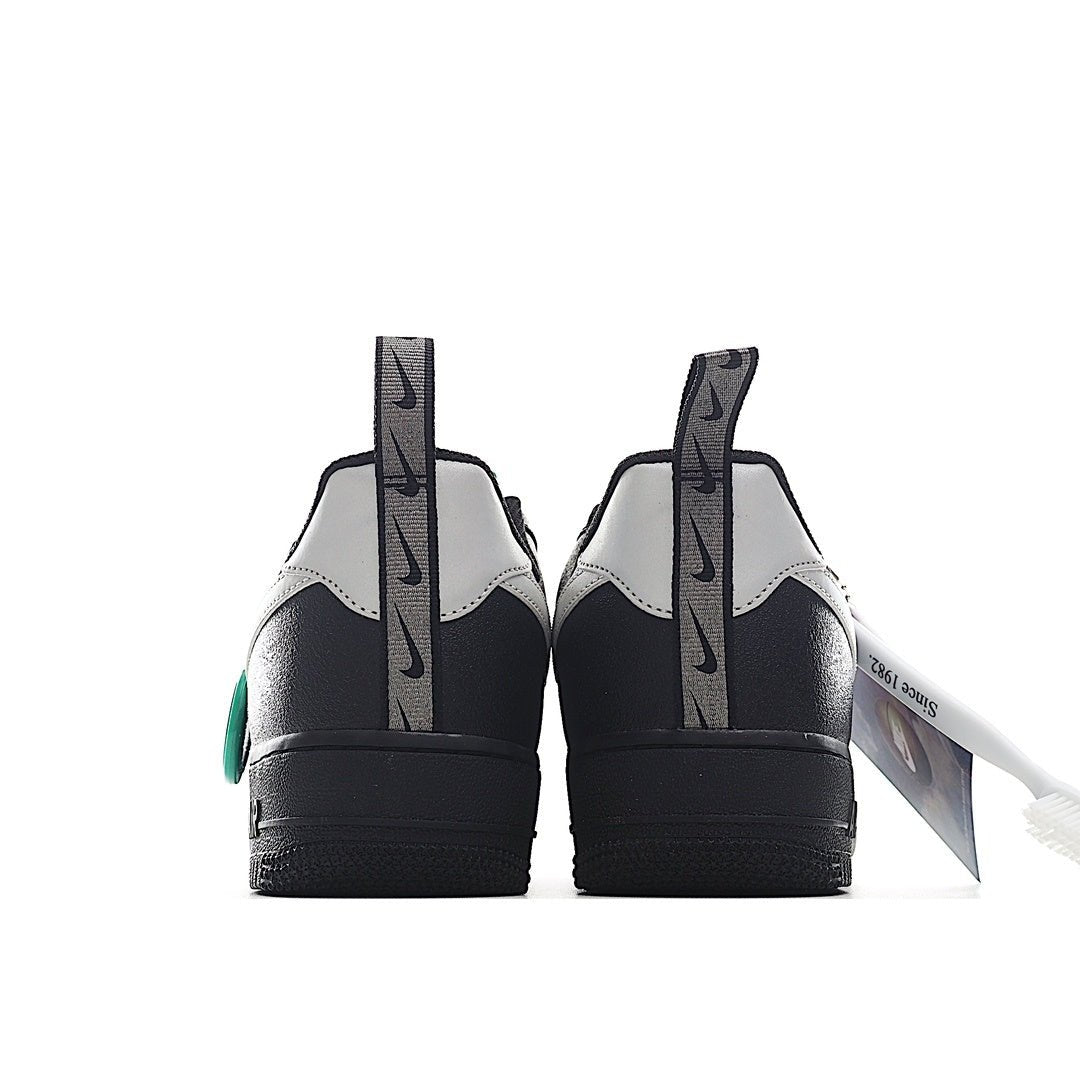 Nike Air Force 1 low-top sneakers, rear view with black heel and white side panel