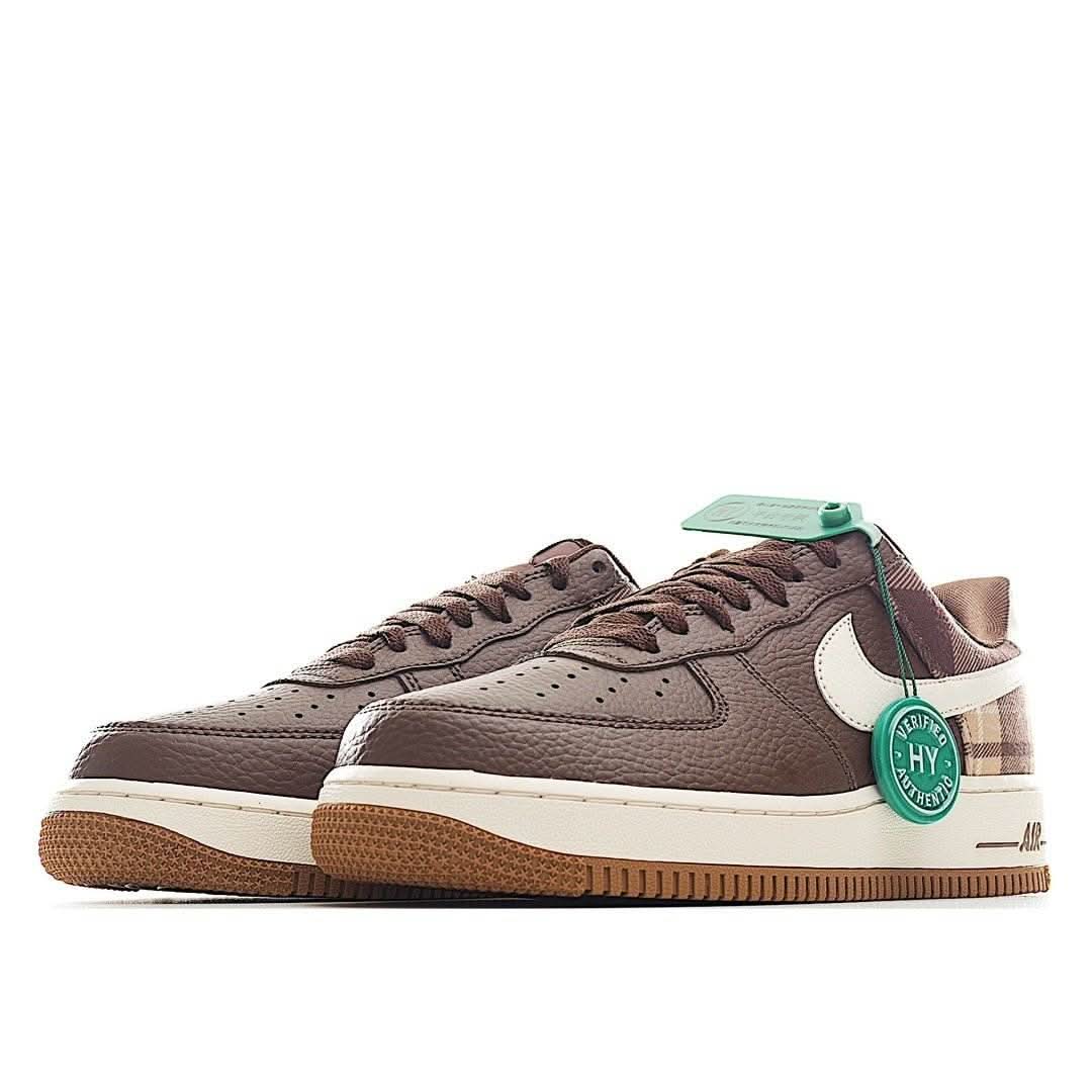 Brown low-top sneakers with white swoosh, lace-up front, gum sole, green HY tag