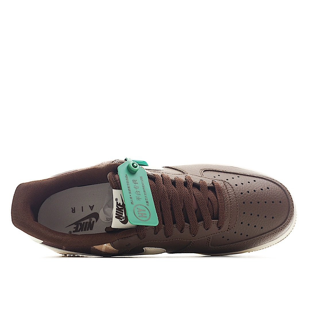 Brown leather low-top sneaker from side, green hang tag, white midsole