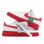 Low-top sneaker pair, white uppers with red swooshes and red midsoles