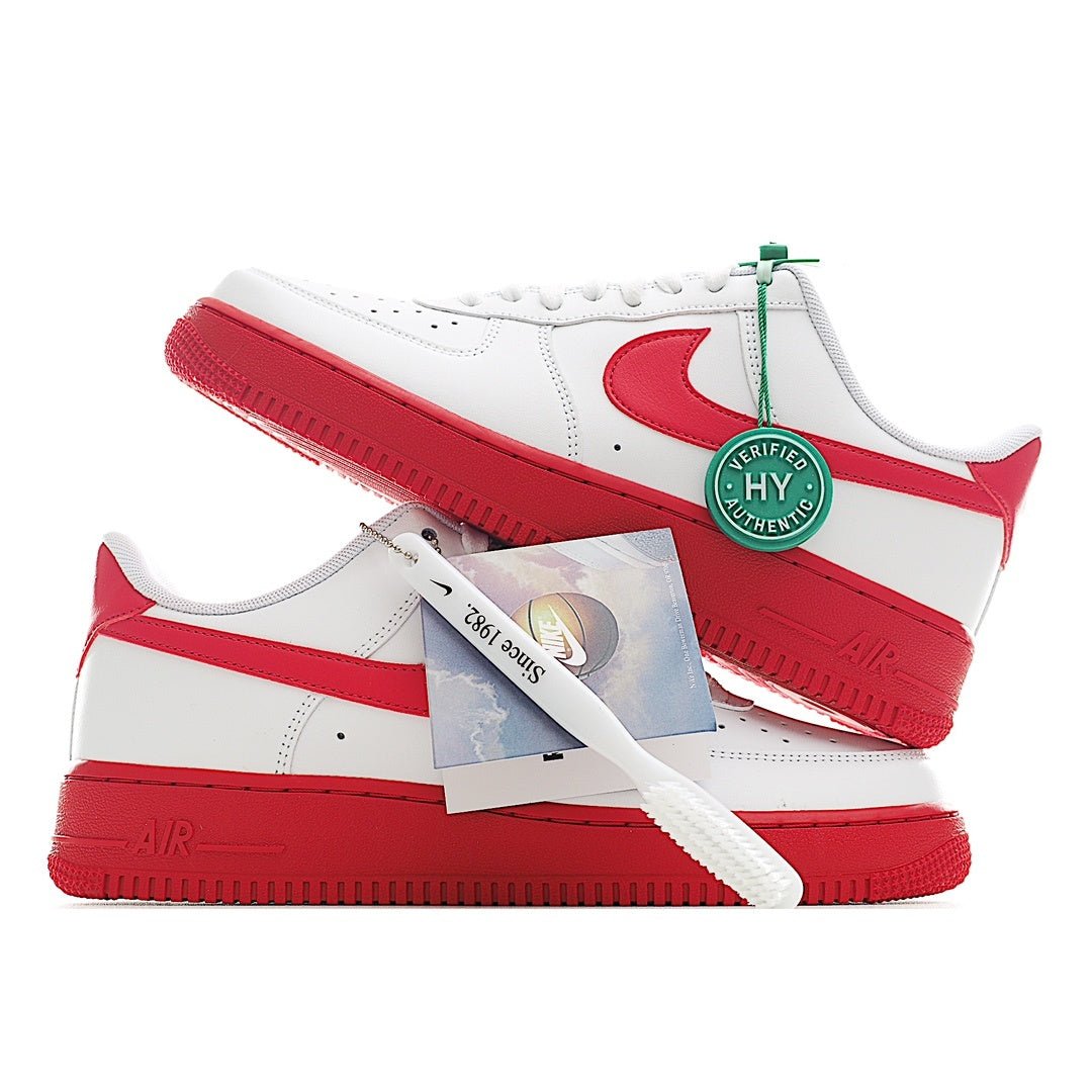 Low-top sneaker pair, white uppers with red swooshes and red midsoles