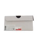 Shoebox, white with black handle cutout, with swoosh logo and barcode label