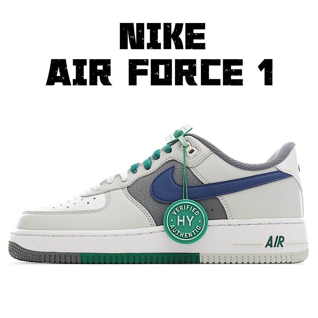 White low-top sneaker with blue swoosh and green accents, lace-up, gum sole.