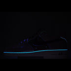Dark low-top sneaker with blue LED-style light trim