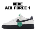 Low-top sneaker in white with black swoosh and green lace tag, black rubber sole.
