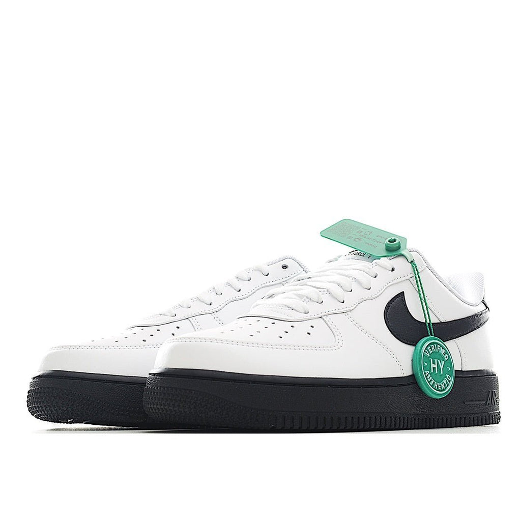 Low-top sneaker, white upper with black swoosh, green laces, and black outsole.