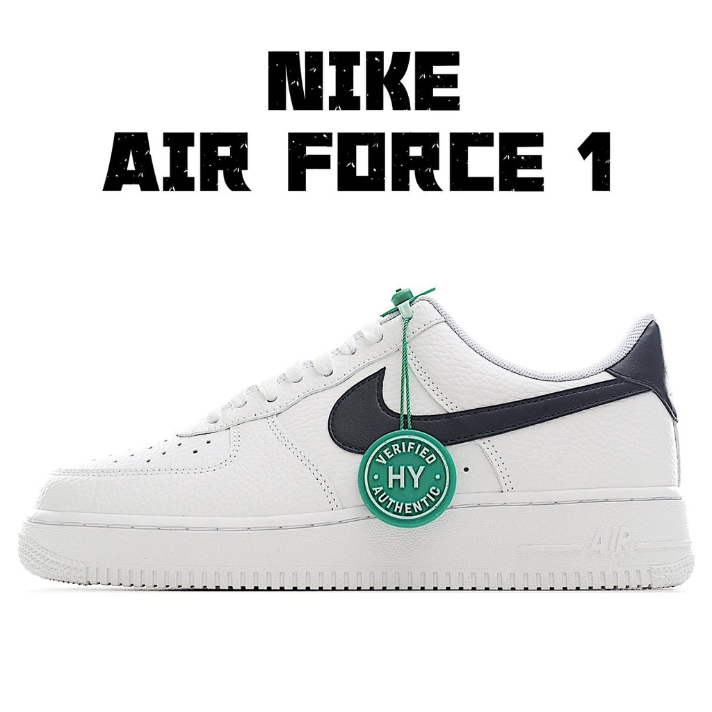 White leather Air Force 1 sneaker with black swoosh and green lace tag