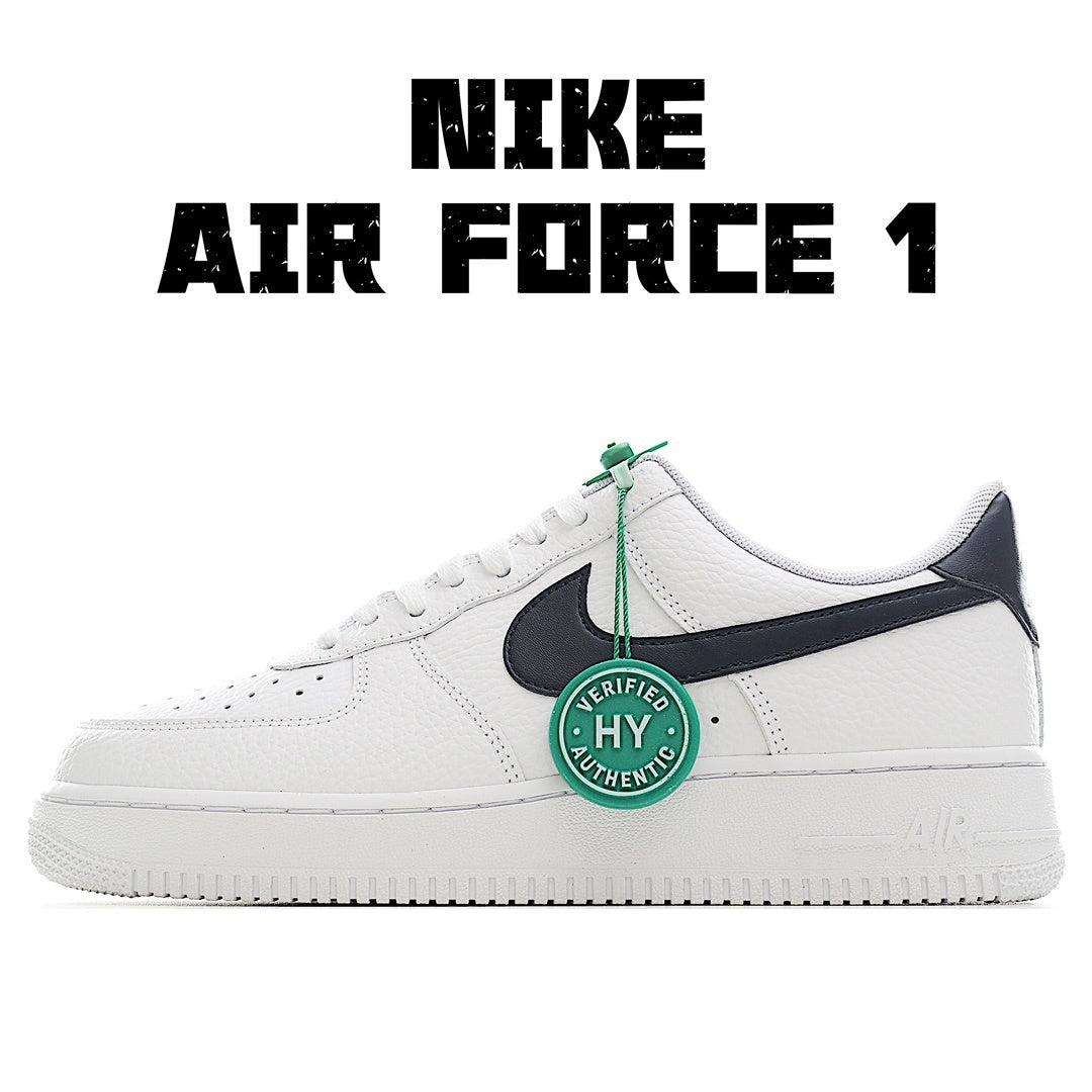 White leather Air Force 1 sneaker with black swoosh and green lace tag