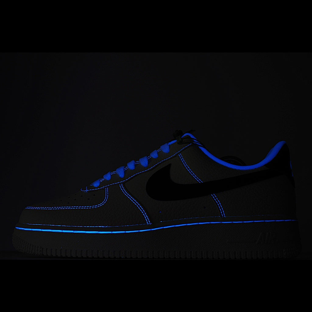 Dark blue low-top sneaker with black swoosh and blue contrast stitching