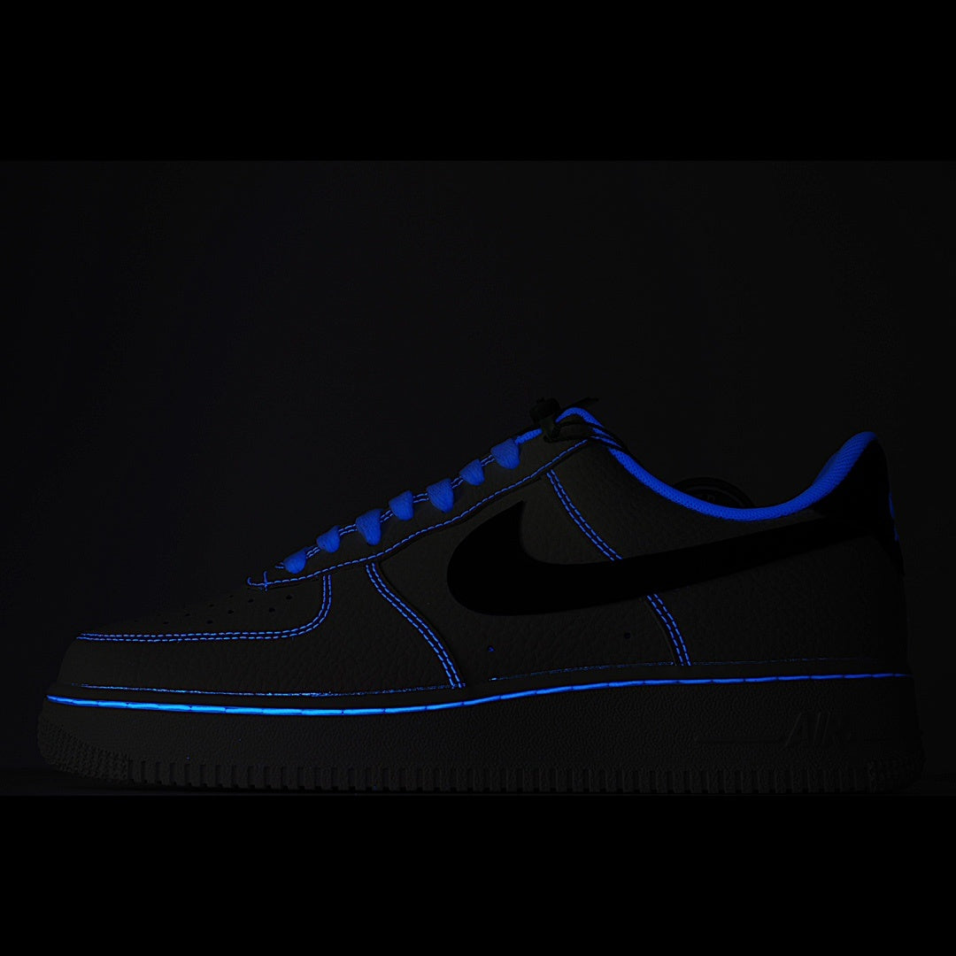 Dark blue low-top sneaker with black swoosh and blue contrast stitching