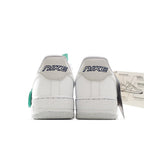 White Nike Air Force 1 low-top sneakers, showing heel with Nike branding and teal tab