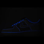 Dark blue Nike sneakers with blue swoosh and lace trim