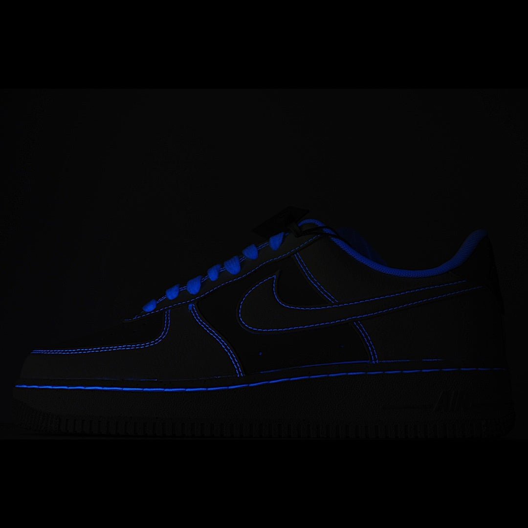 Dark blue Nike sneakers with blue swoosh and lace trim