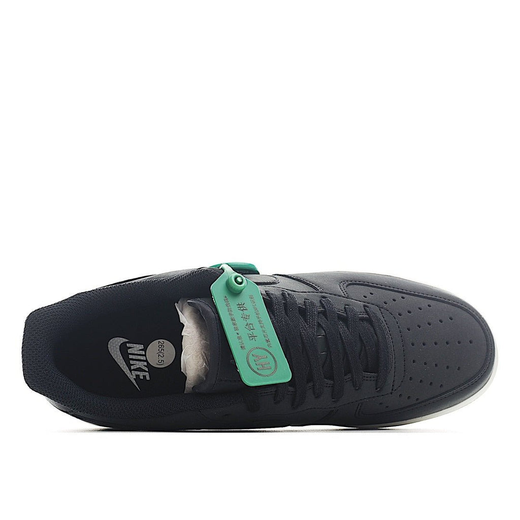 Nike Air Force 1 low-top sneaker heel, dark upper with green inner tag and white sole