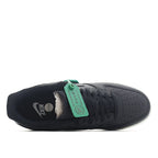 Nike Air Force 1 low-top sneaker heel, dark upper with green inner tag and white sole