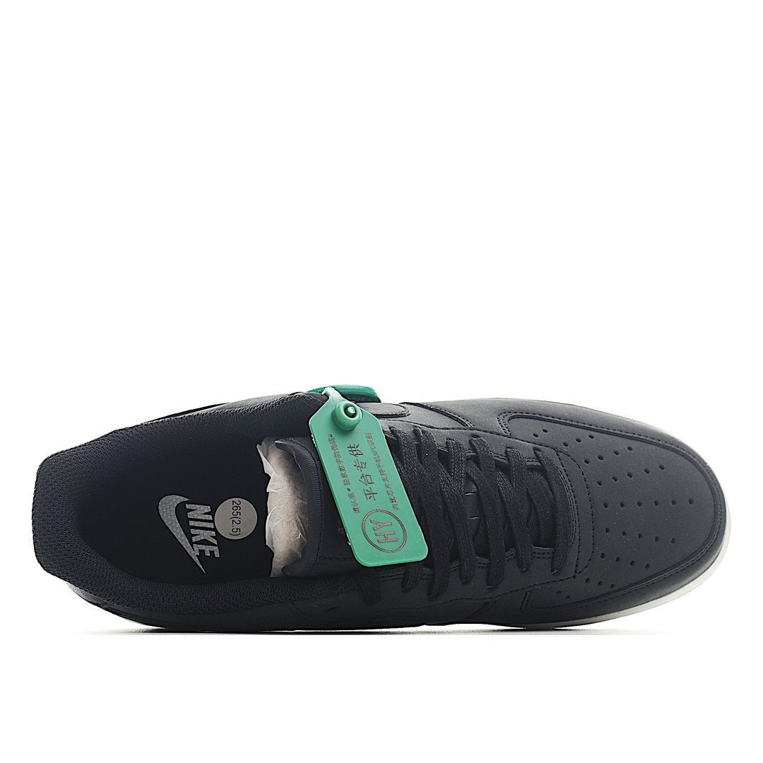 Nike Air Force 1 low-top sneaker heel, dark upper with green inner tag and white sole