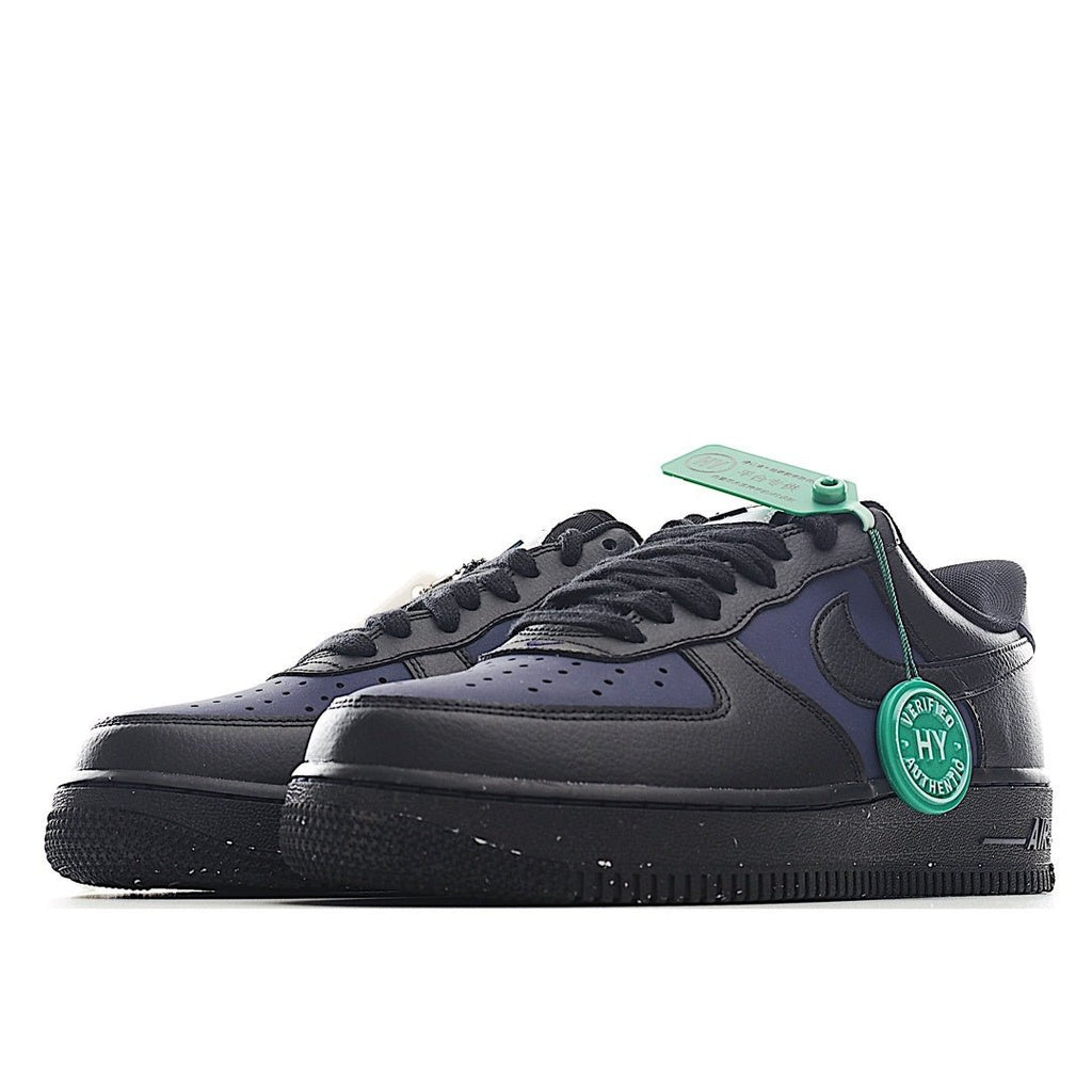 Navy and black low-top sneakers, side view with green hang tag
