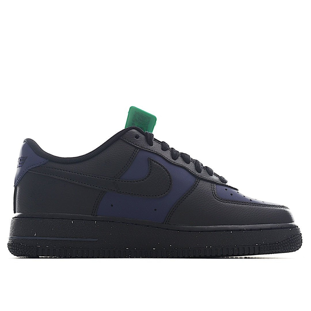 Navy and black low-top sneakers, side view with green hang tag
