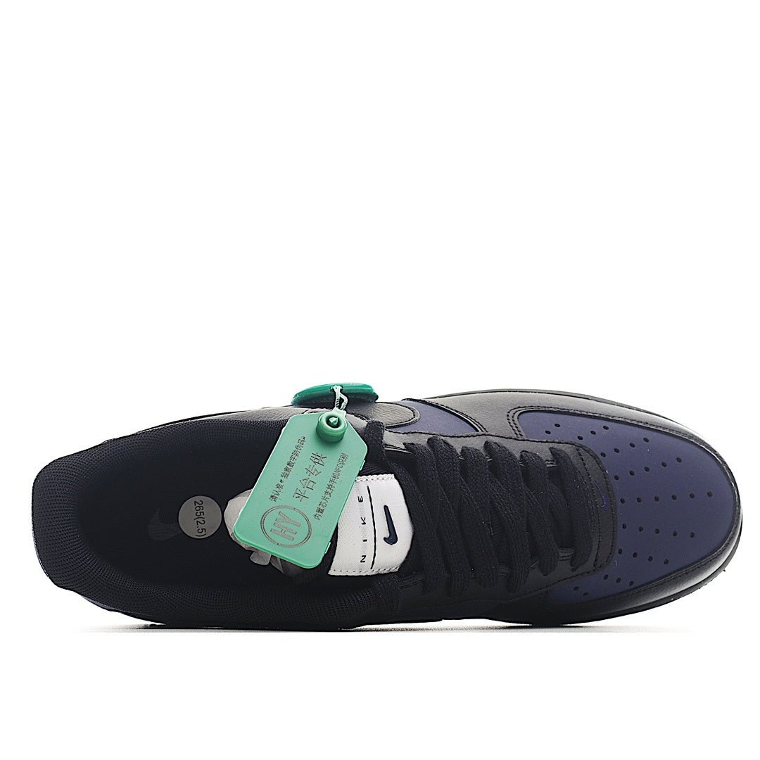 Navy and black low-top sneakers, heel view with green hang tag