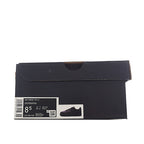 Navy shoe box with shipping label and product image