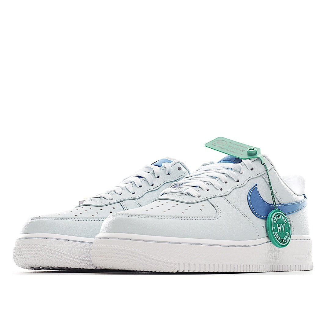 White and light blue Nike Air Force 1 sneakers with mint tag and blue swoosh