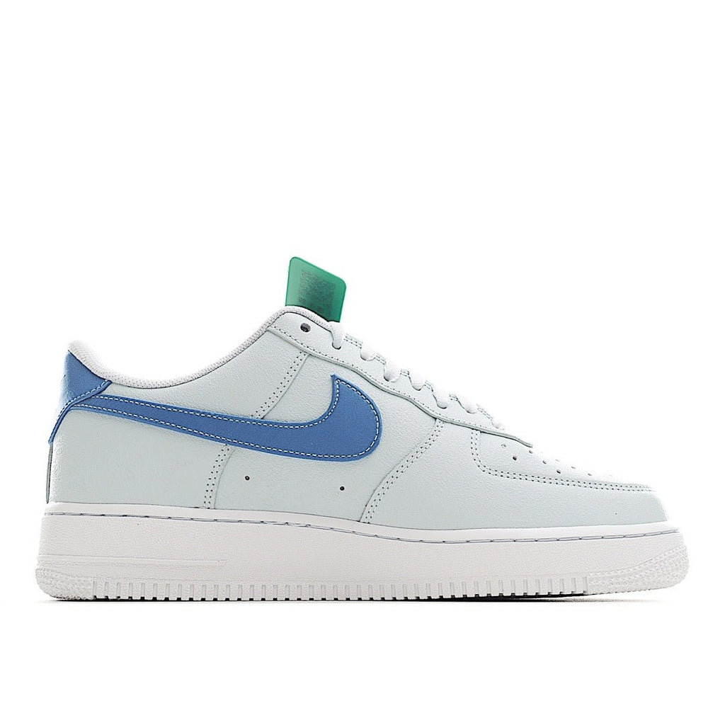 White Nike Air Force 1 low-top sneaker with blue side swoosh and mint heel tab