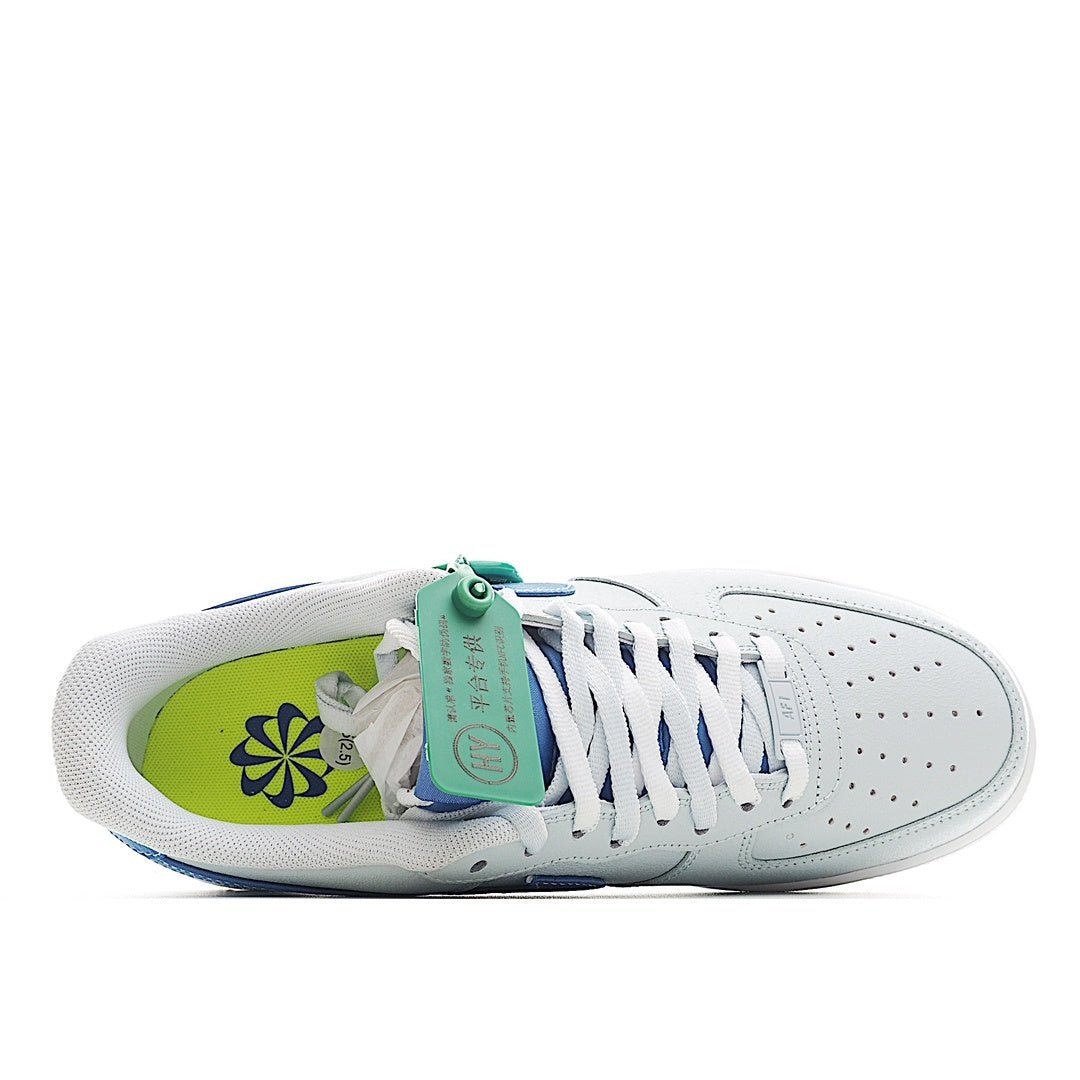 White Nike Air Force 1 sneaker interior with green insole and blue laces