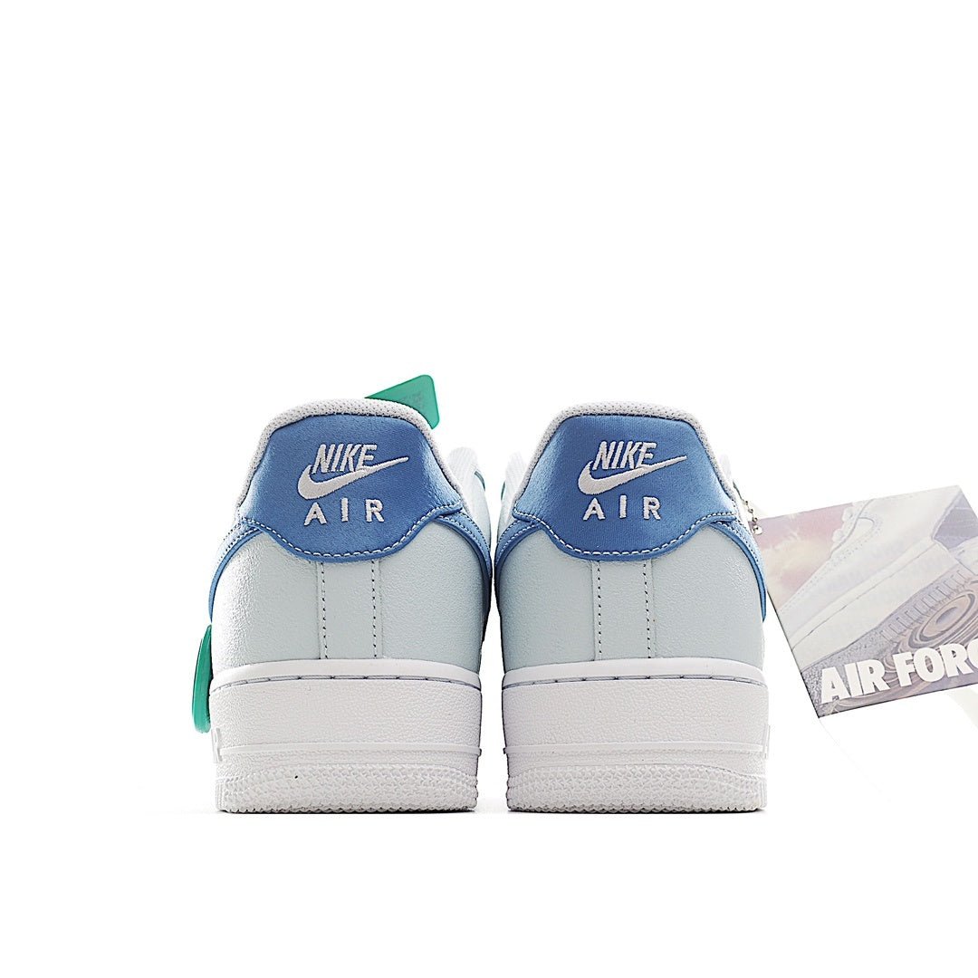 Light blue Nike Air Force 1 sneakers with NIKE AIR heel branding and mint accents