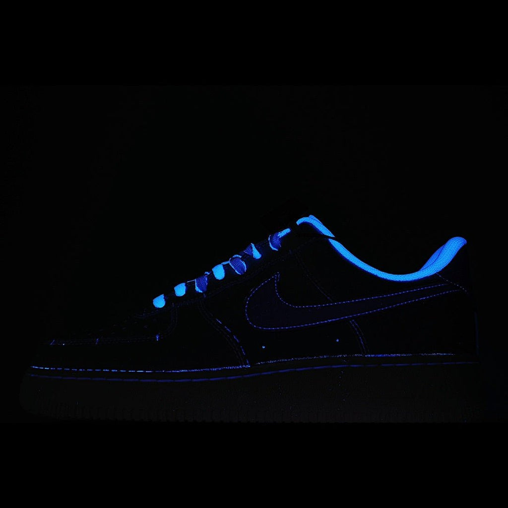 Dark blue Nike Air Force 1 sneakers with neon blue glowing outline