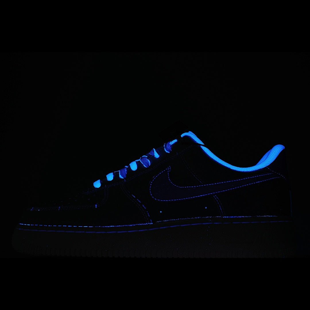 Dark blue Nike Air Force 1 sneakers with neon blue glowing outline