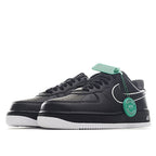 Nike Air Force 1 low-top sneakers, black with neon-green accents, and white midsole.