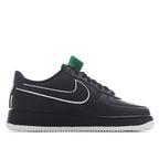 Nike Air Force 1 low-top sneakers, black leather upper with teal collar tab.