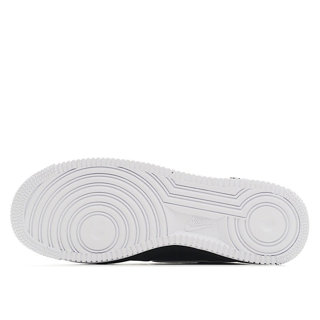 Nike Air Force 1 outsole, white rubber tread with circular traction pattern.