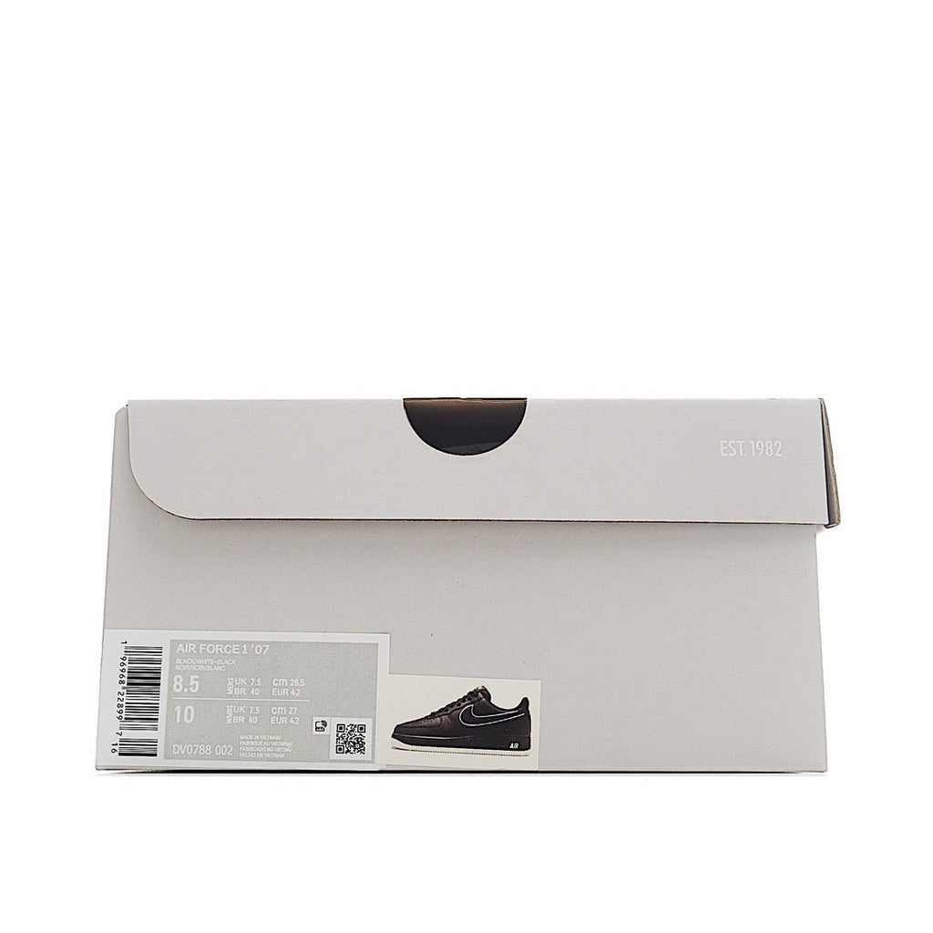 Nike Air Force 1 shoe box, light gray with label and product/size sticker.
