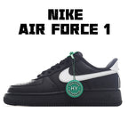 Low-top sneakers in black with white side panel and green lace tag detail