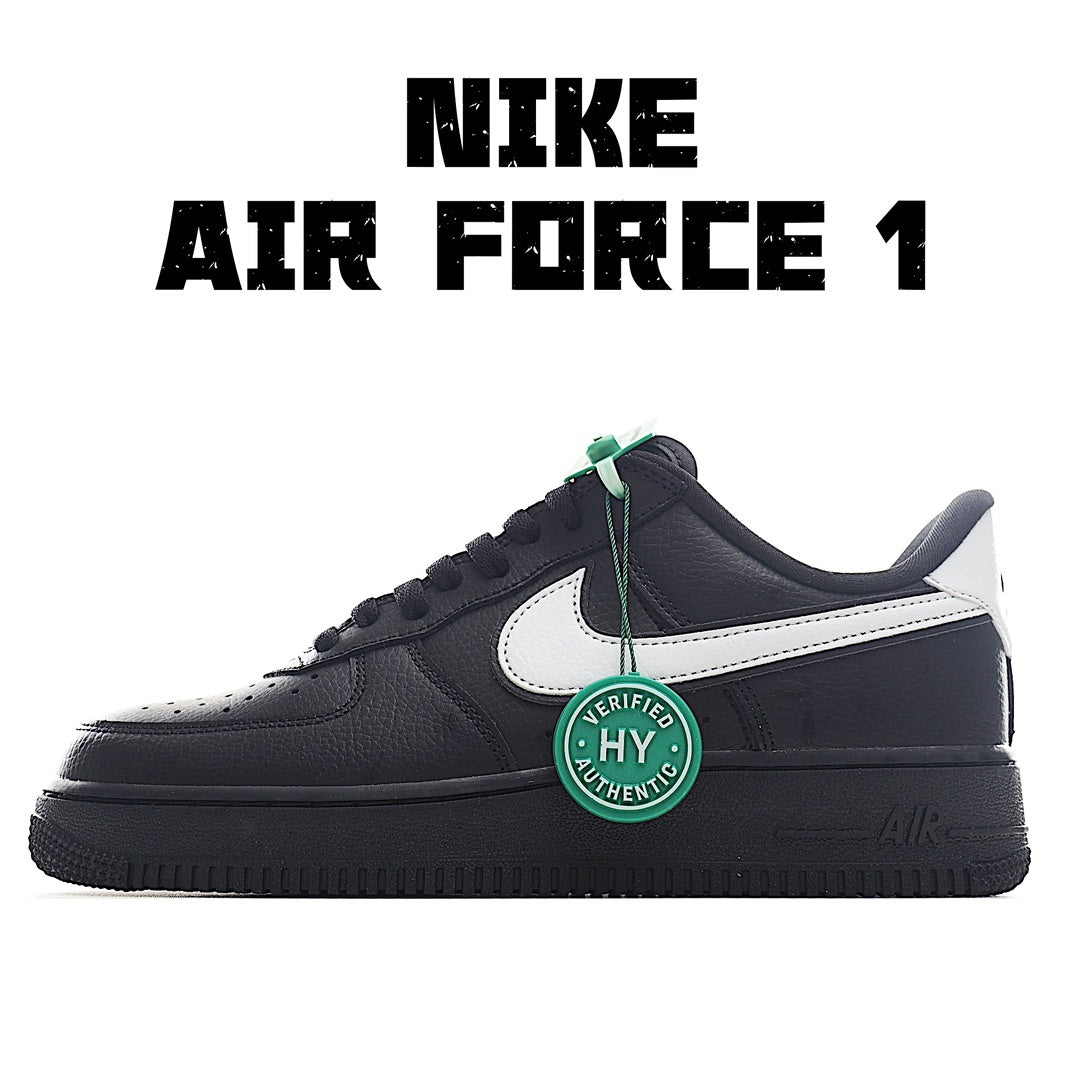Low-top sneakers in black with white side panel and green lace tag detail