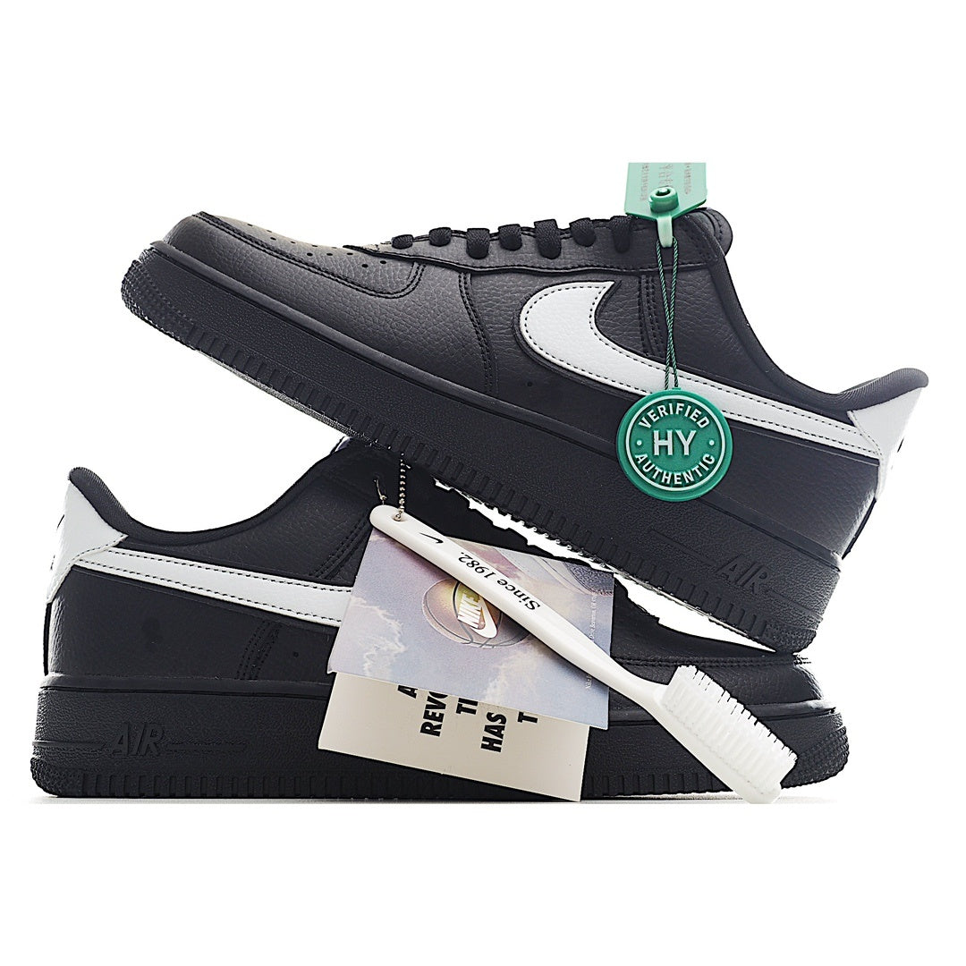 Low-top sneakers with black uppers, white swoosh, and green HY verification tag