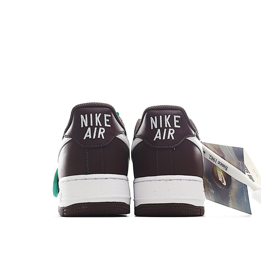 Brown Nike sneakers with white midsole, green heel detail, and Air branding on back