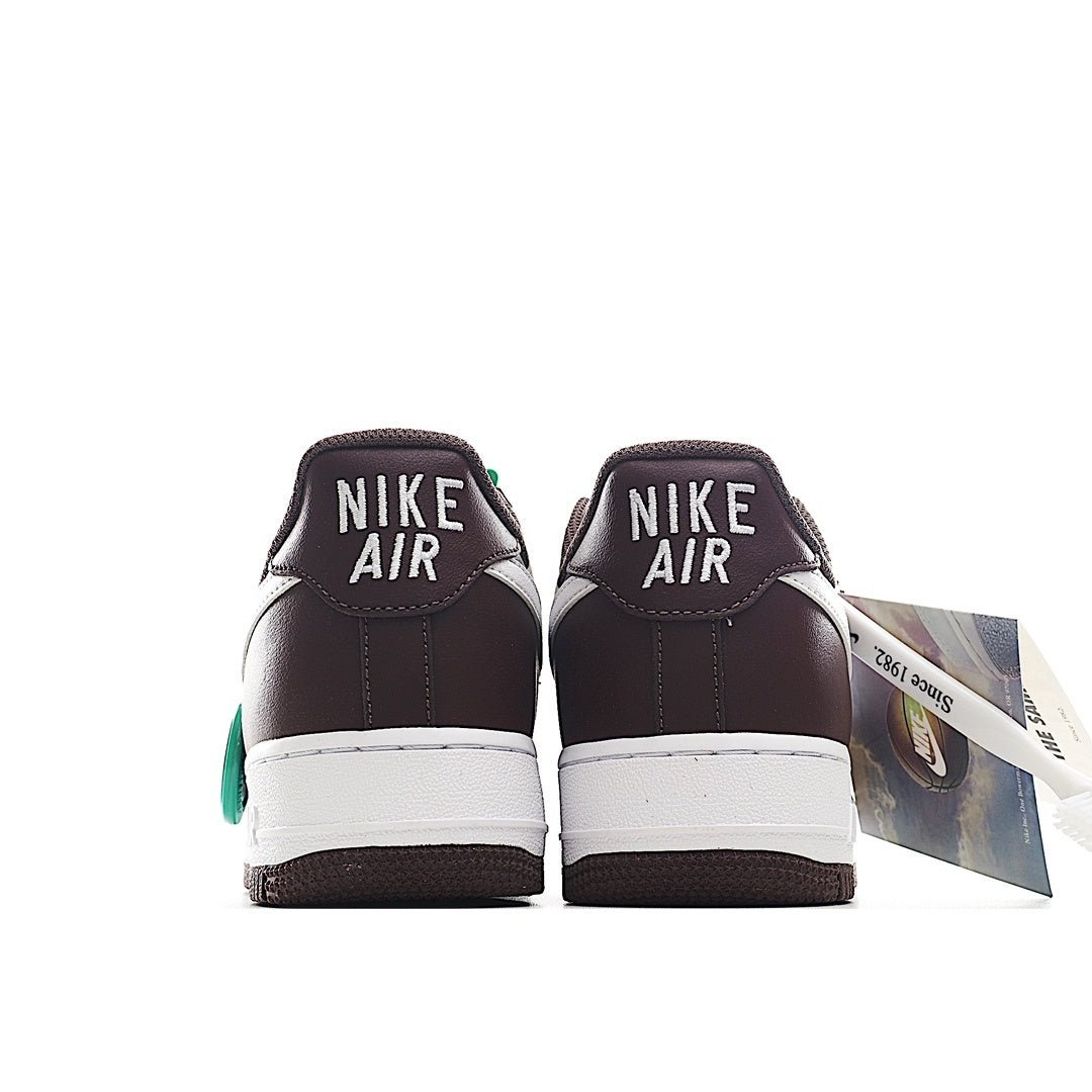 Brown Nike sneakers with white midsole, green heel detail, and Air branding on back